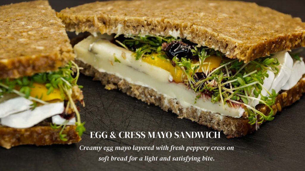 Egg and cress mayo sandwich on soft white bread with a generous filling of chopped farm-fresh eggs and peppery mustard cress.