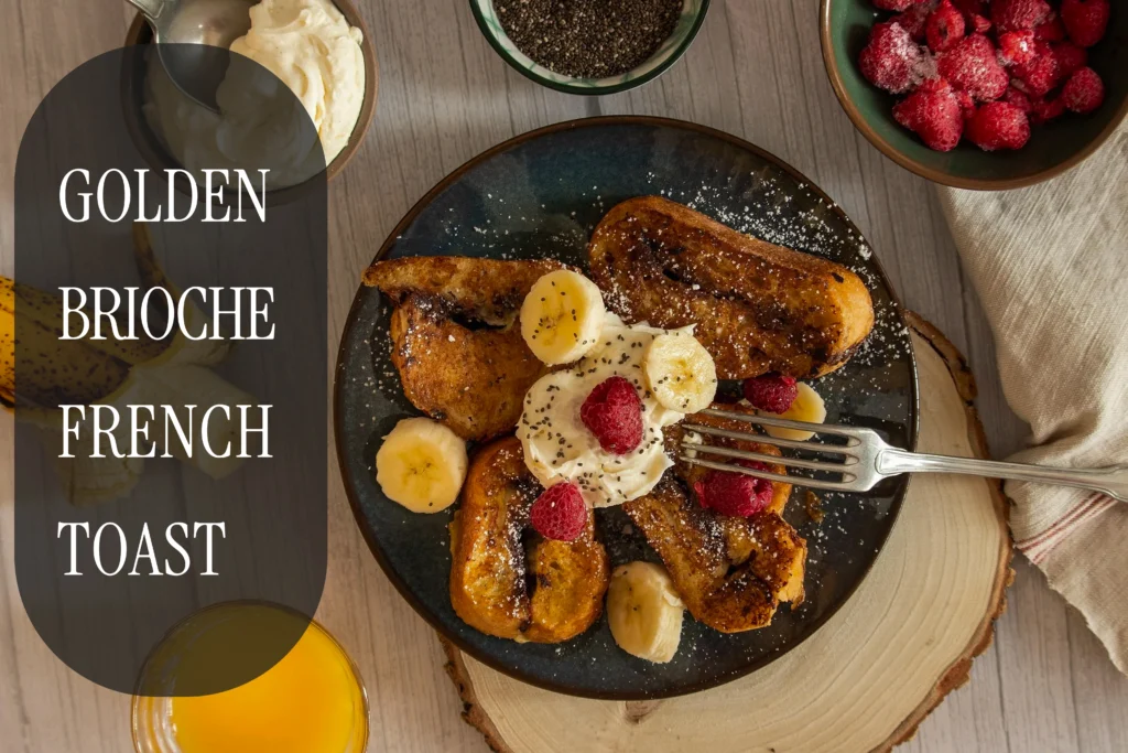 Golden-brown brioche French toast stacked with fresh berries, a dusting of powdered sugar, and flowing maple syrup.