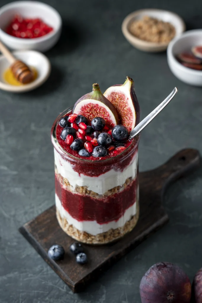 Classic English trifle with layers of sponge, jelly, custard, and cream.