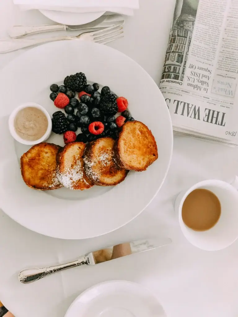 hick-cut brioche French toast dusted with powdered sugar.