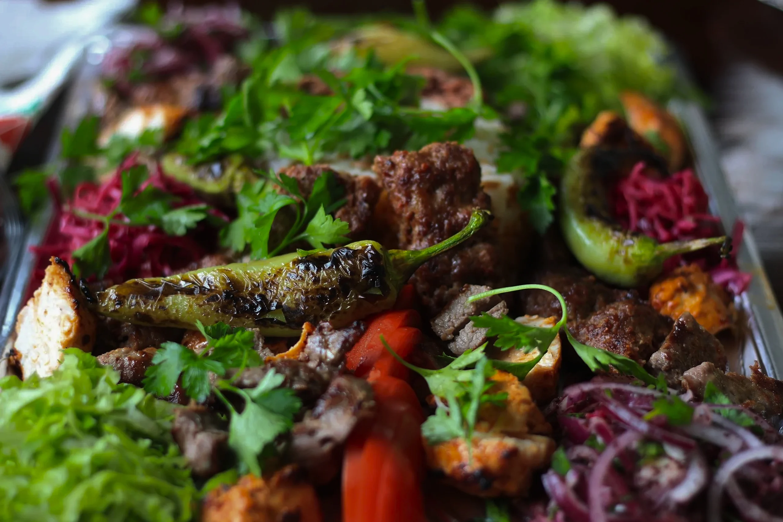 Tender pieces of lamb in an authentic Rogan Josh sauce served in a bowl, a gluten-free dinner idea.