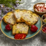 Close-up of a serving of warm bread pudding showing layers of buttered bread soaked in nutmeg-spiced custard.
