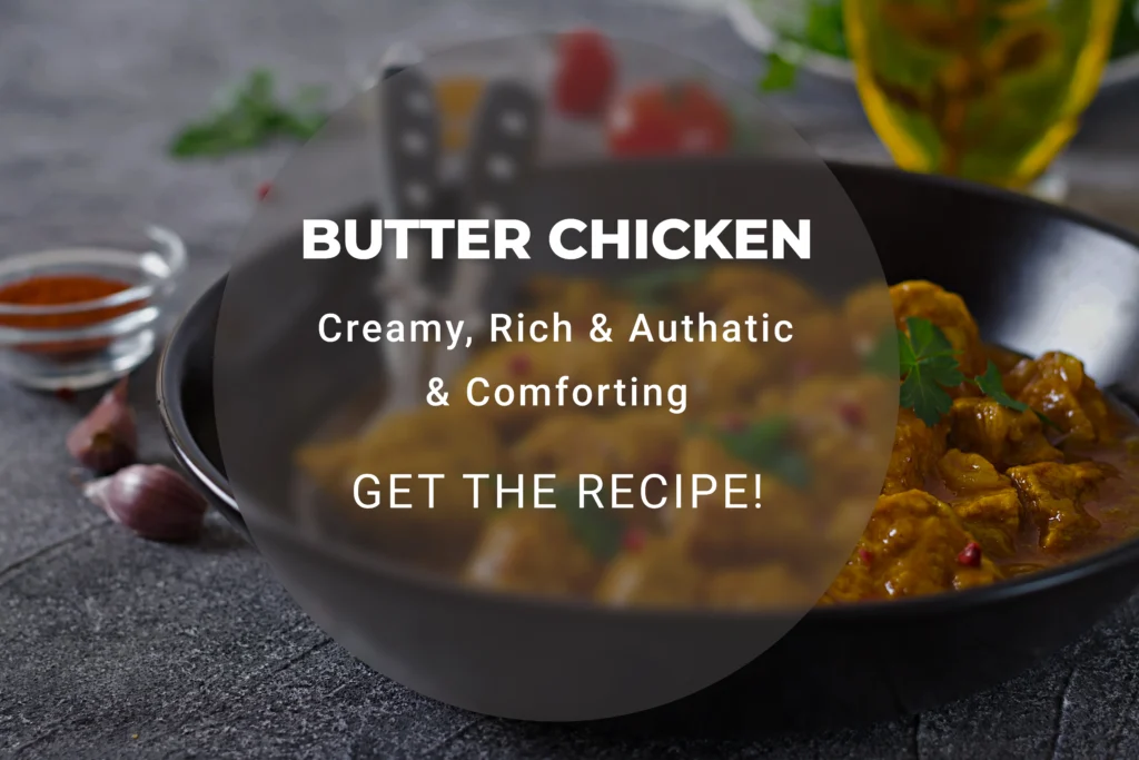 Creamy Murgh Makhani butter chicken in a rich tomato gravy with a swirl of fresh cream and cilantro.