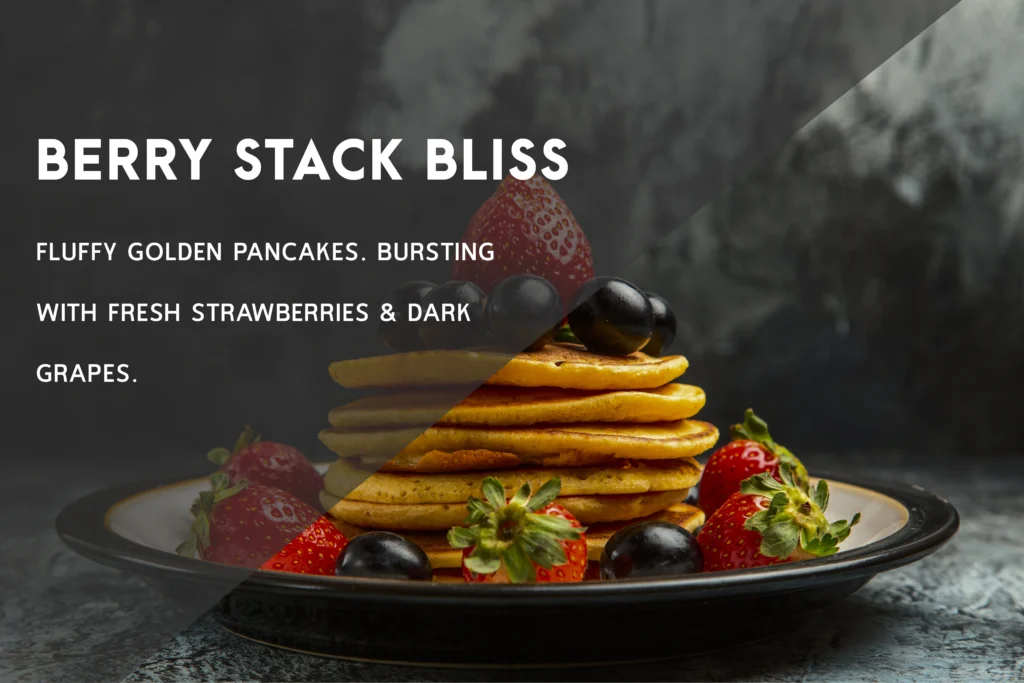 A tall stack of thick, fluffy American pancakes with a melting pat of butter and maple syrup dripping down the sides.