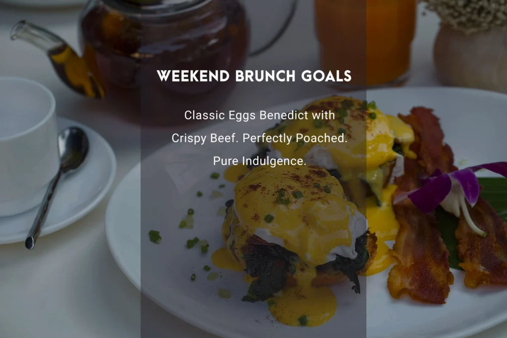 Best Eggs Benedict recipe featuring two perfectly poached eggs on toasted English muffins with silky homemade Hollandaise sauce and fresh chives.