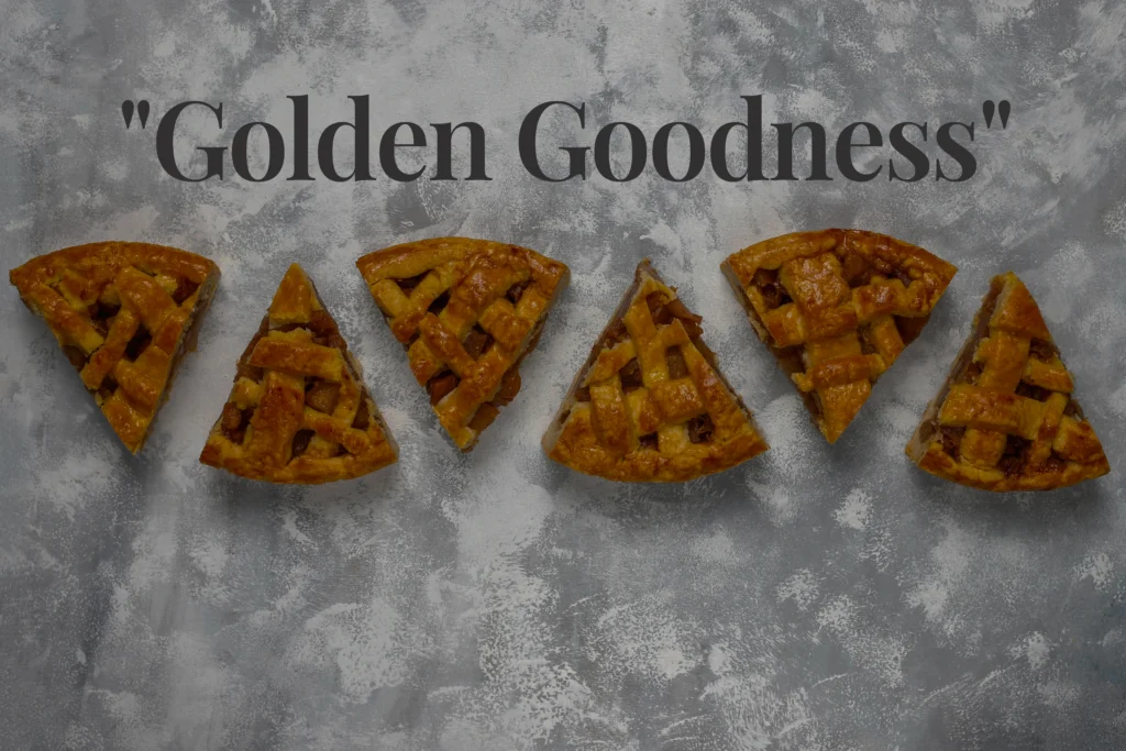 Close-up of a golden, perfectly baked shortcrust pastry tart shell on a marble surface. The edges are crisp and fluted, showing a buttery, crumbly texture ideal for sweet or savory fillings.