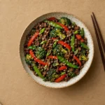 Plate of crisp ground beef stir fry with colourful vegetables, ready to eat