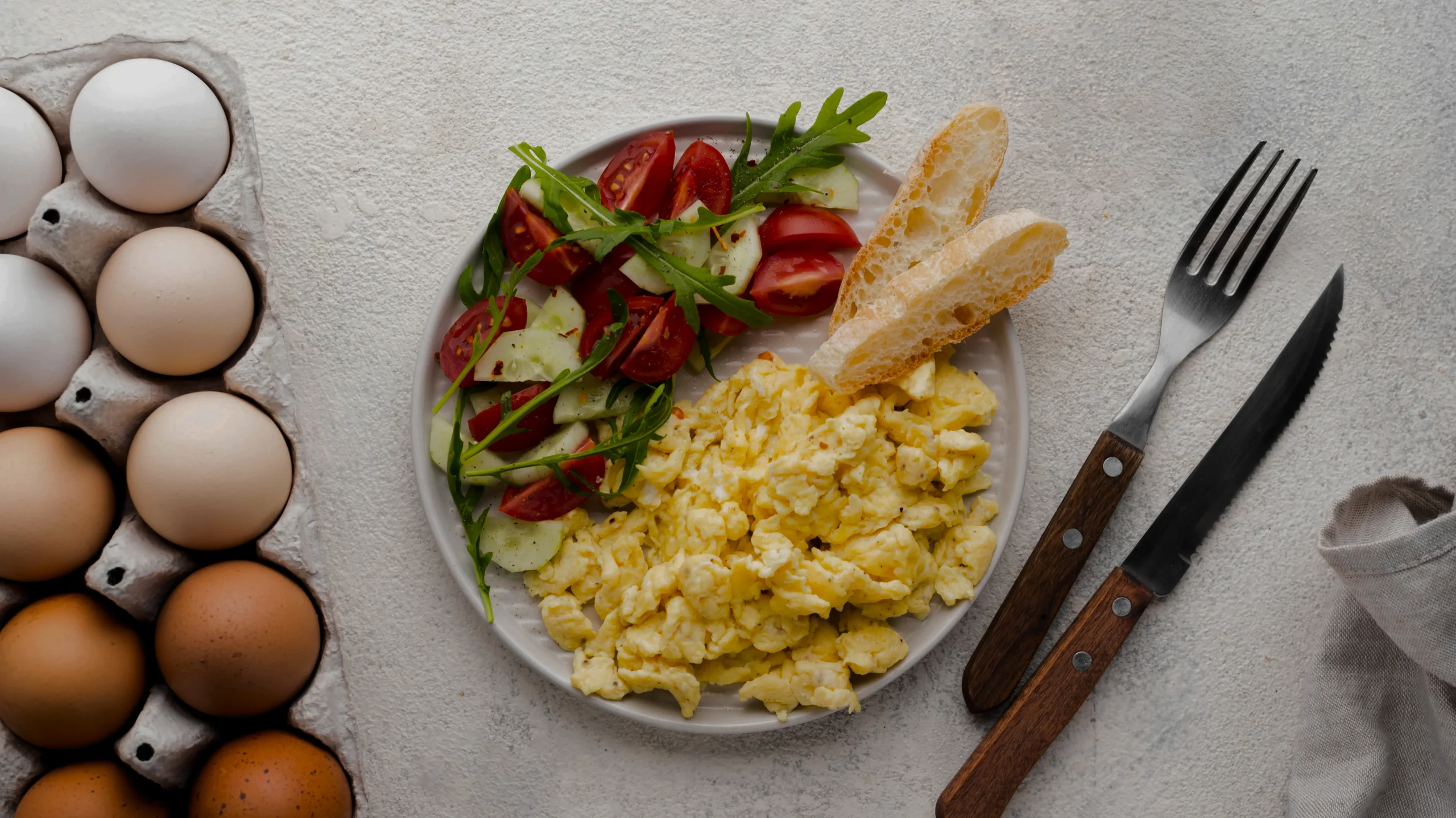 Close-up of velvety scrambled eggs with small curds, demonstrating the perfect low-and-slow cooking technique