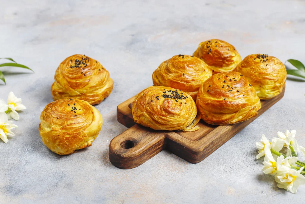 Homemade buttery puff pastry with many visible thin layers.