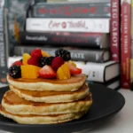 Close-up of fluffy Scotch Pancakes with a light and airy texture, golden on the outside and soft inside, served on a plate for a quick and easy breakfast recipe