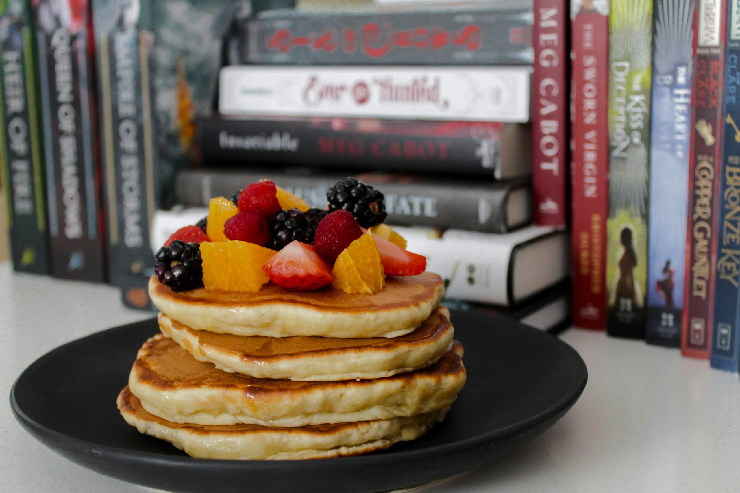 Close-up of fluffy Scotch Pancakes with a light and airy texture, golden on the outside and soft inside, served on a plate for a quick and easy breakfast recipe