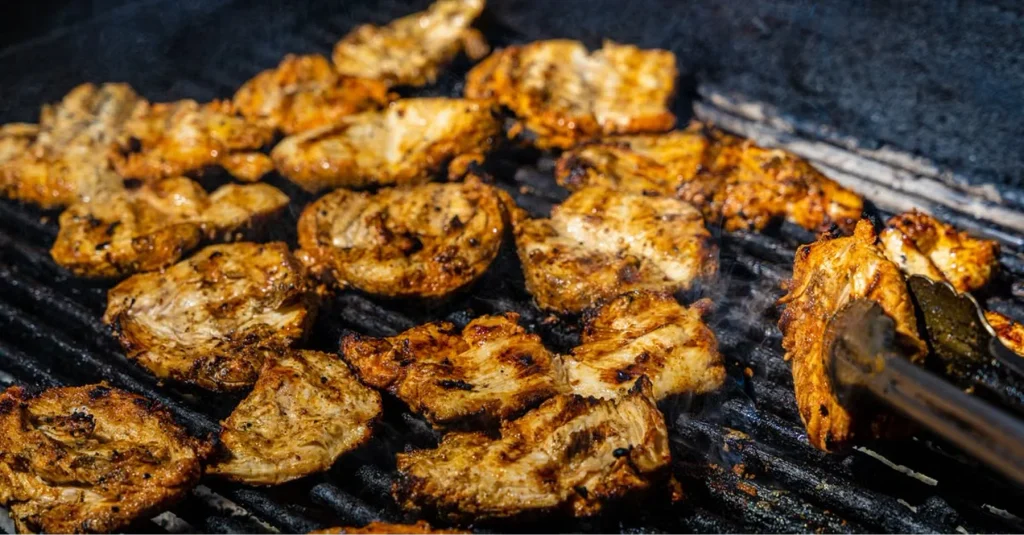 image 13 Chicken breasts grilling with golden char marks