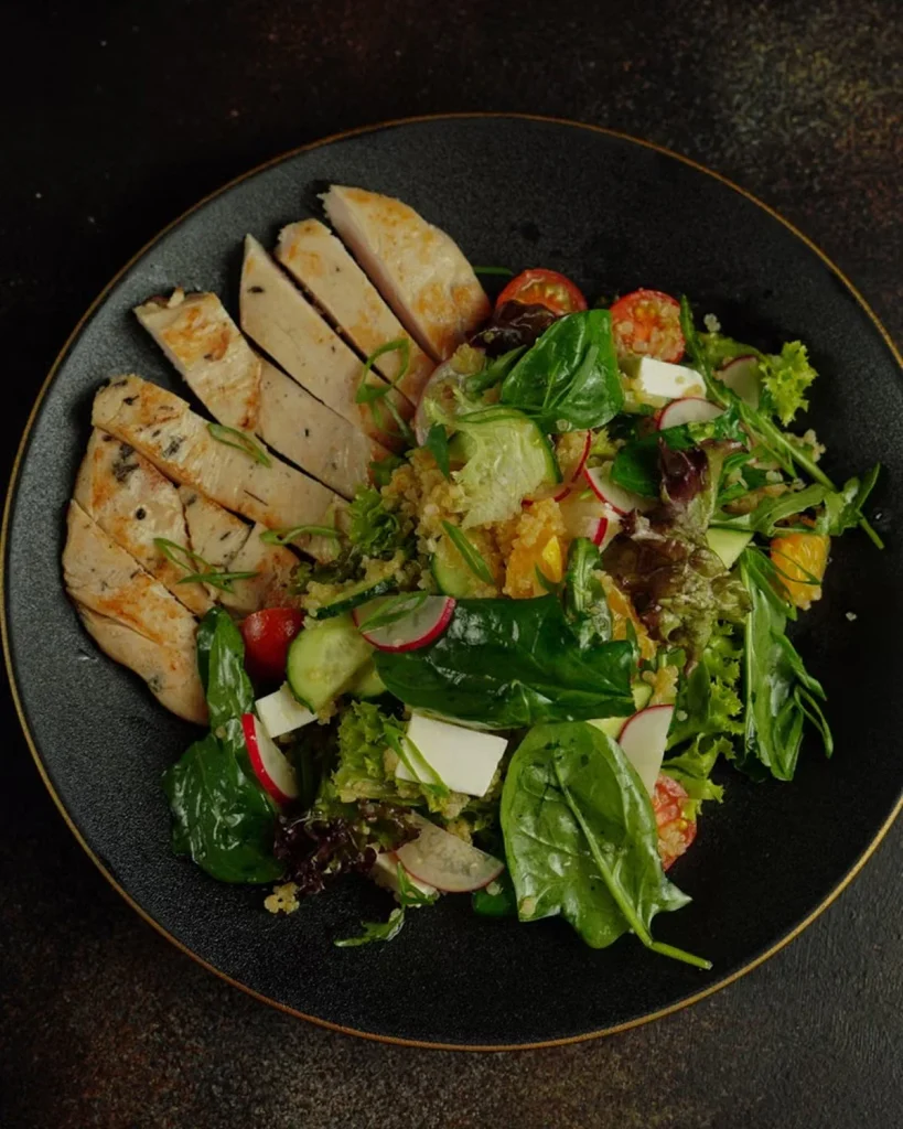 image 16 Close-up of a forkful of grilled chicken and quinoa