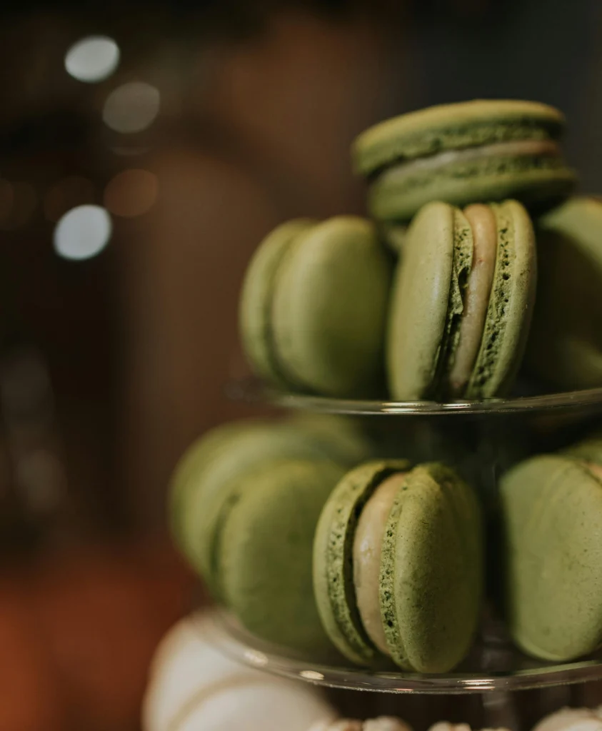 Pistachio and white chocolate macarons with smooth shells and creamy filling, elegant homemade French dessert