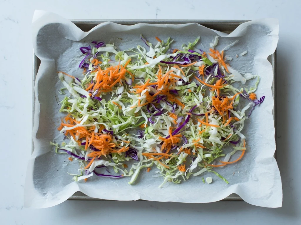 Frozen shredded cabbage stored in a freezer-safe container for later use.